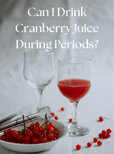 Glass of cranberry juice and bowl of cranberries